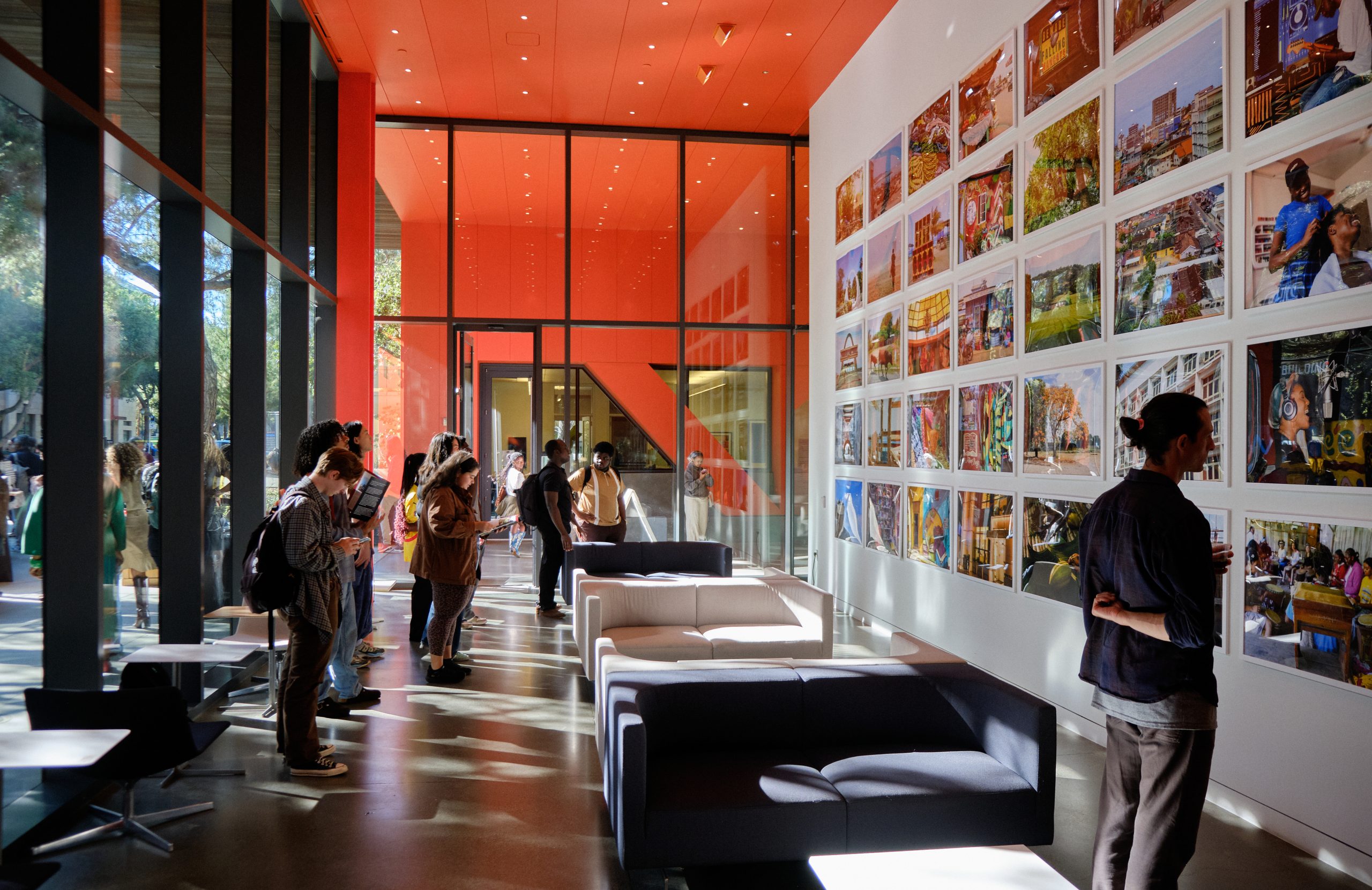 Visitors view the exhibition made up of photos contributed by students.