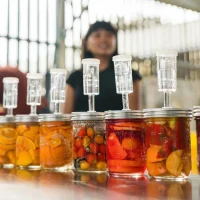 Fermentation Workshops at the O'Donohue Family Stanford Educational Farm wit jars of colorful fruits and vegetables