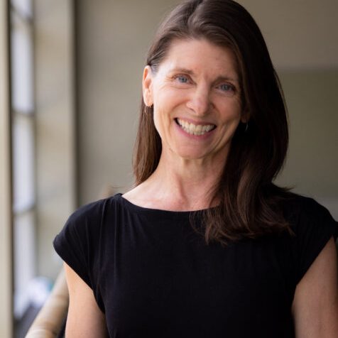 Person looking towards camera and smiling