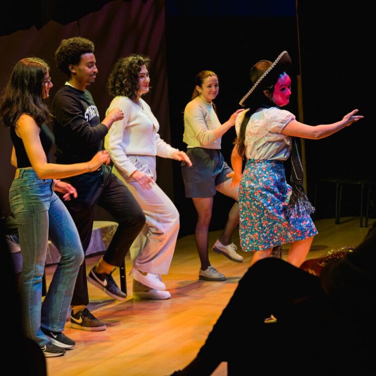 Engaging the audience in the play, Valentina teaches audience members one of the dances. Photo courtesy of Harrison Truong.