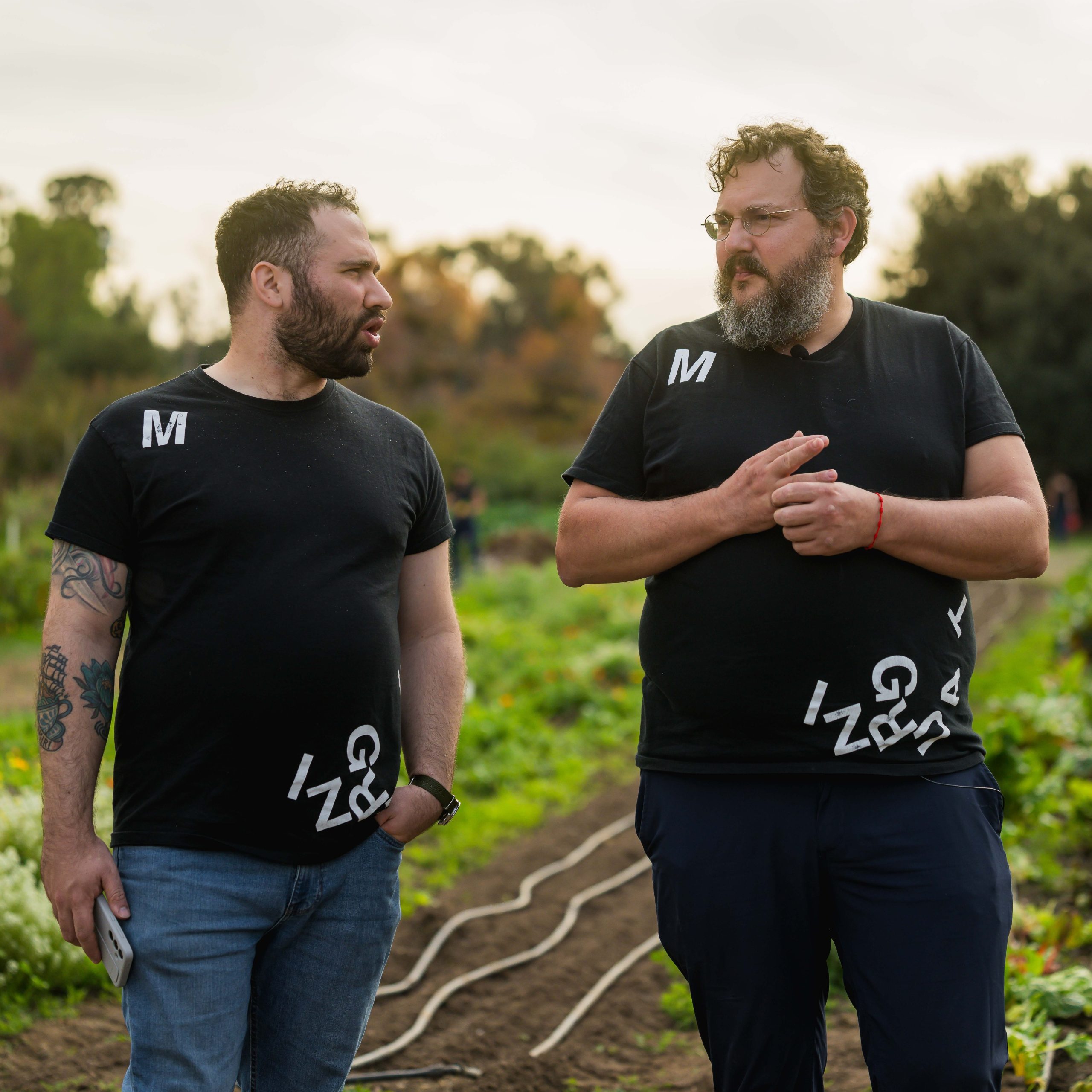 Ramon Perise and Jordi Bross from Mugaritz talking at the crop fields at the O'Donohue Family Stanford Educational Farm