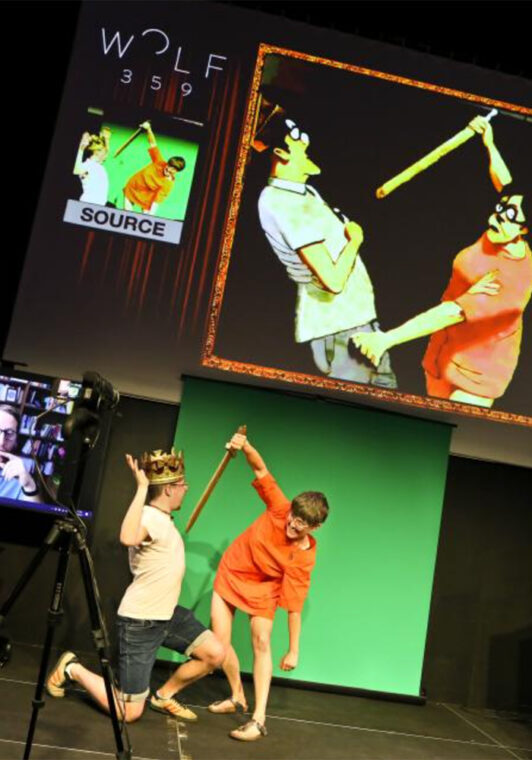 On stage, actors depict a sword-fight scene while an AI mimics their movements. | Birgit Hupfeld