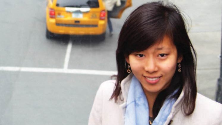 Woman in front of NYC Taxi