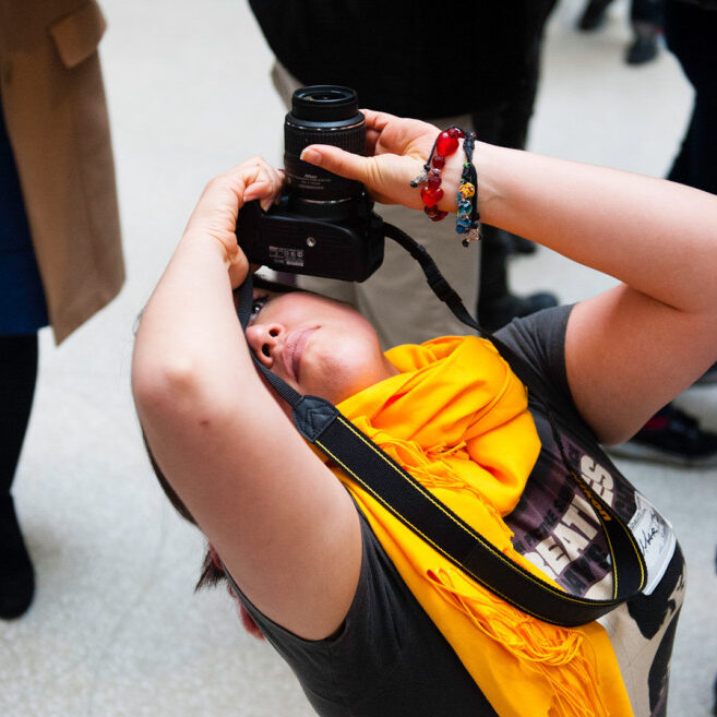 Junior Alexis Lucio takes a picture of the Guggenheim Museum skylight.