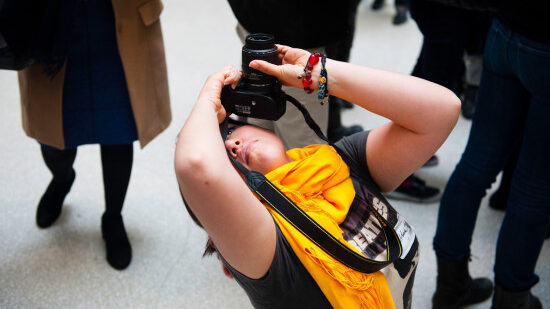 Junior Alexis Lucio takes a picture of the Guggenheim Museum skylight.