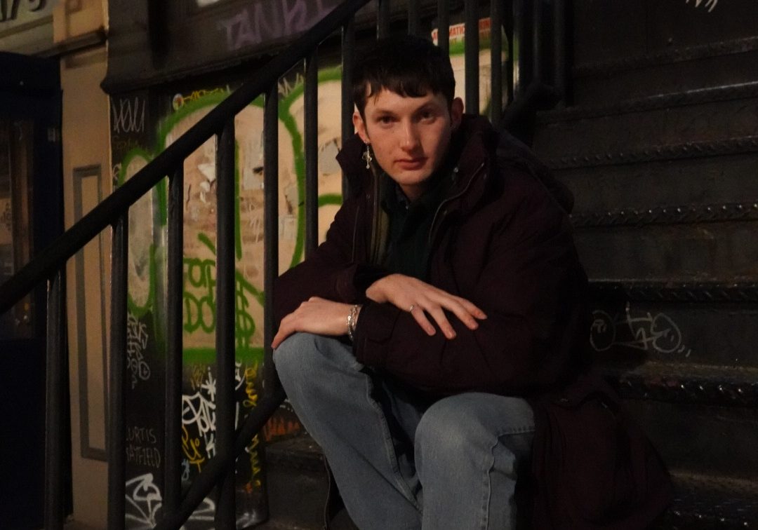 Photo of the author, a white man on a city street at night. Photo by Bryan Monge Serrano