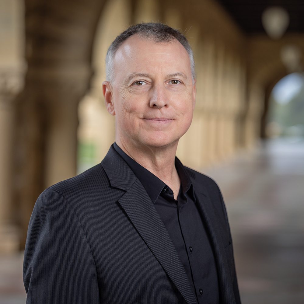A photo of Marcelo Clerici-Arias wearing a black shirt and jacket