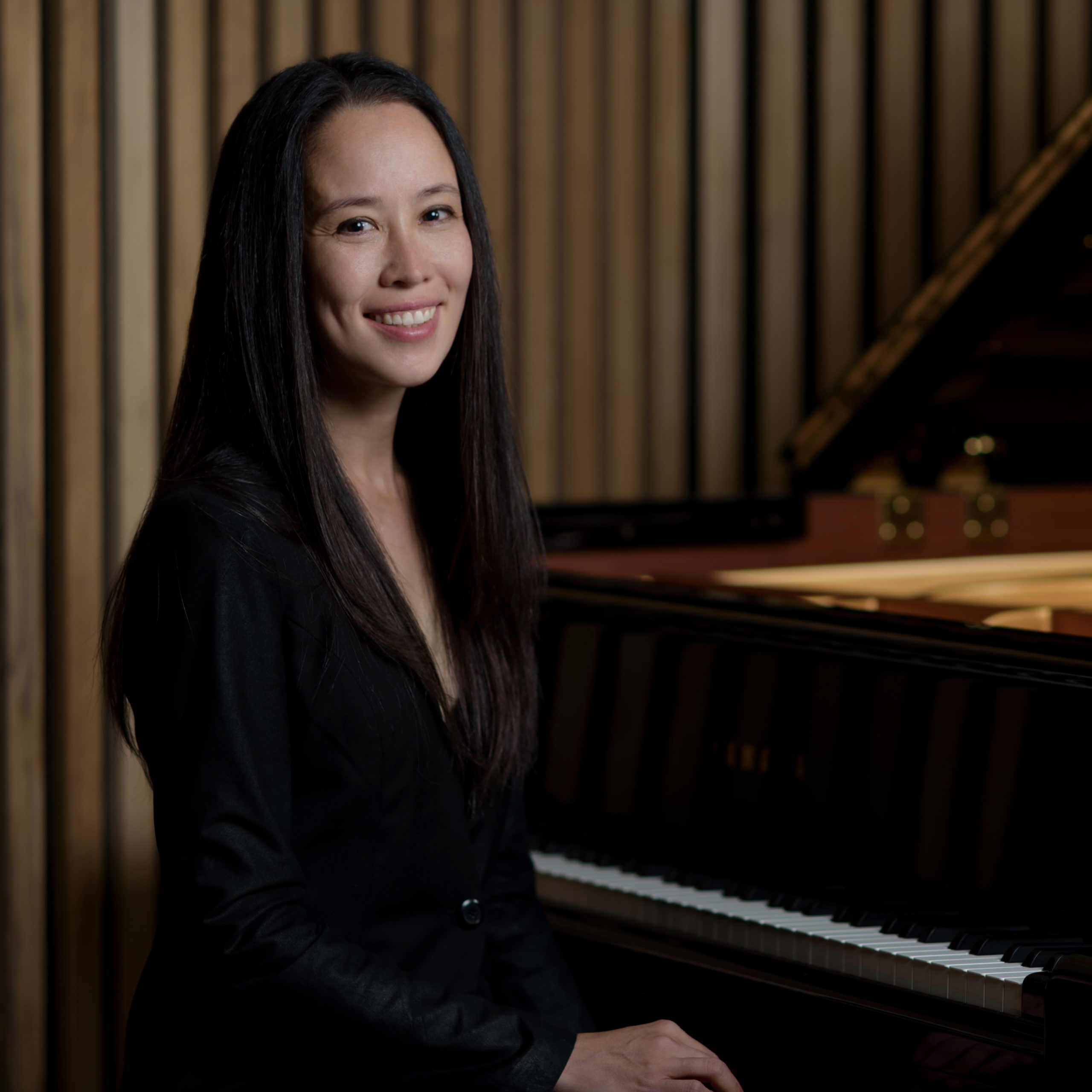A photo of Elizabeth Schumann at a piano