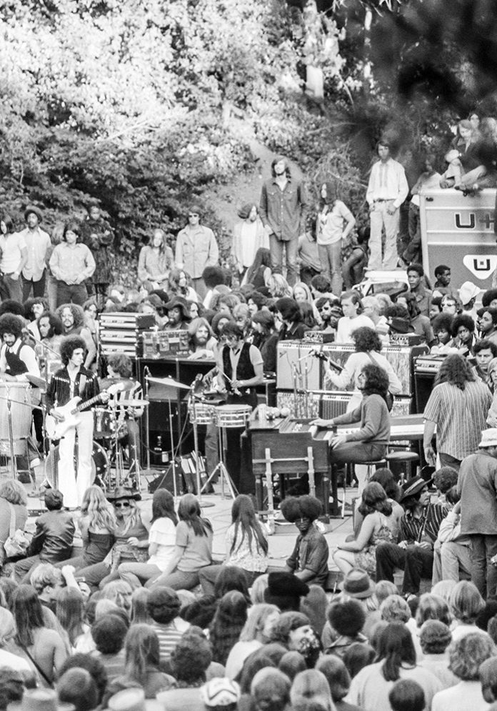 Santana plays an impromptu concert at Frost Amphitheater in 1971, with Carlos Santana on guitar and Neal Schon at center stage. | David Madison / Getty Images