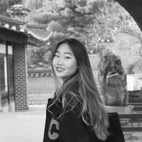 a black and white photo of Hope looking over her shoulder