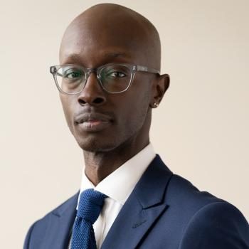 A photo of Matthew Morrison wearing a blue tie and jacket