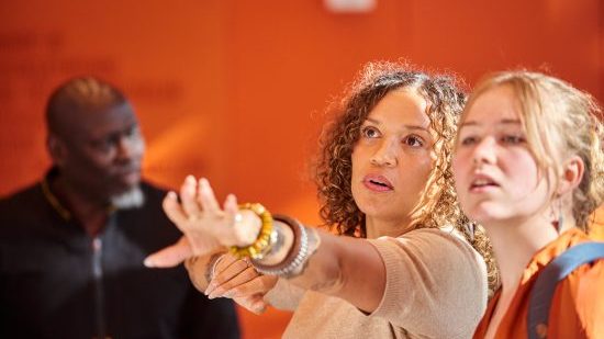 Katie Dieter and student Penelope Keep view the photo exhibit. (Photo: Romi Chiorean)