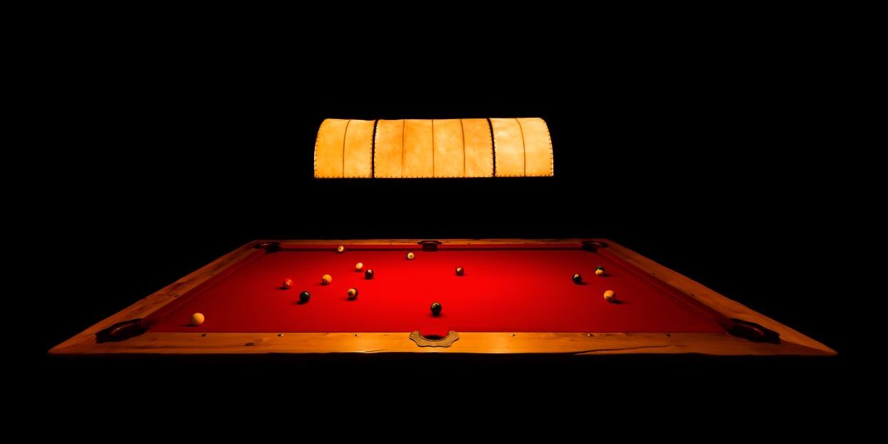 Poster with a black background with red pool table