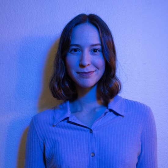 Photo of Vivian in a lavender lighting